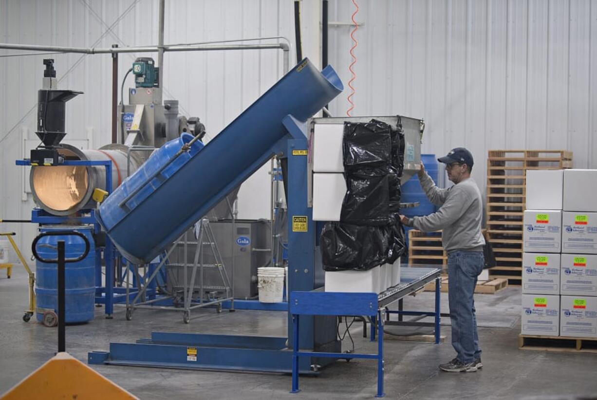 Production worker Rocky Schwab packages glue pellets while working at Northwest Adhesives at the Steigerwald Commerce Center in Washougal. The company is one of a handful that own land at the business park, which is part of the Port of Camas-Washougal.