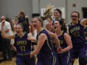 Columbia River players left to right, Lily Jonas, Katie Kolbe, Erin Baker and Ellie Christian react to defeating Washougal in first round of the 2A district girls basketball tournament.