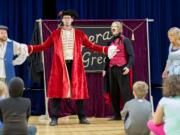 Woodland: Vancouver-based Opera Quest Northwest puts on free opera performances for elementary school students. From left, David Warner, Bruce Kyte, Patrick Scofield and Amy Cole, recently performed at Yale Elementary School students.