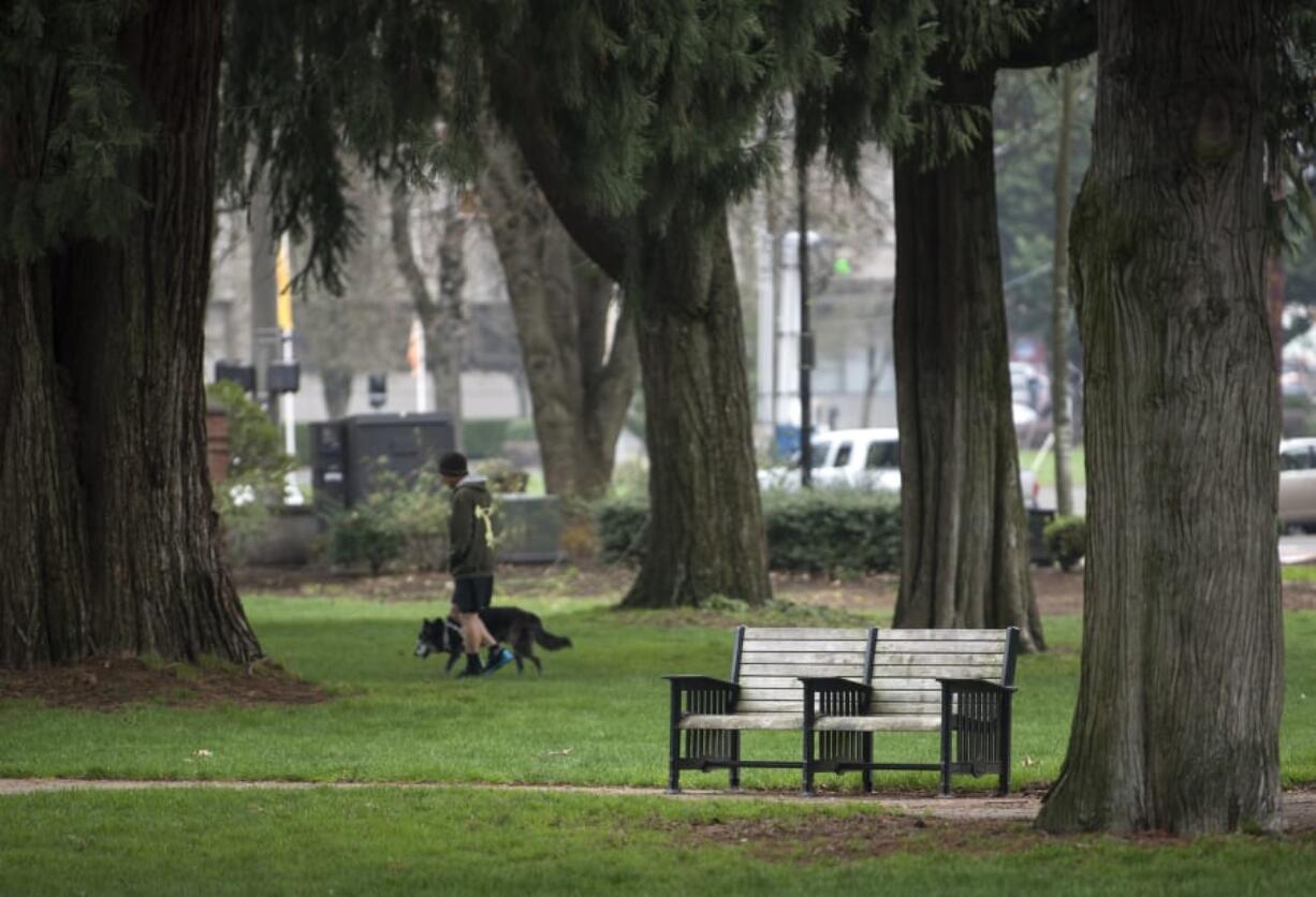 Park benches in Esther Short Park and across the city have intentional arm rests in the center to prevent someone from sleeping comfortably.