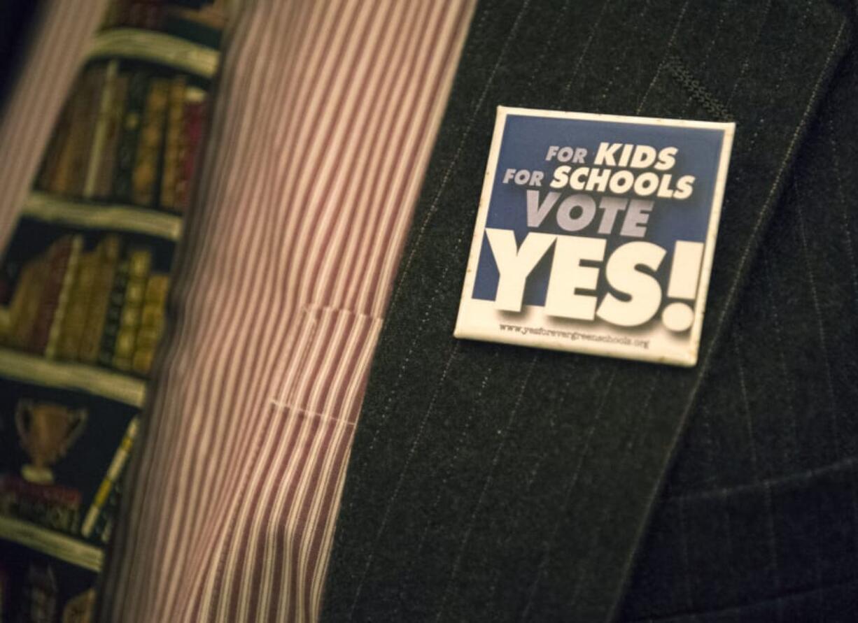 Evergreen Superintendent John Steach sports a pin supporting Evergreen Public Schools' $695 million bond measure.