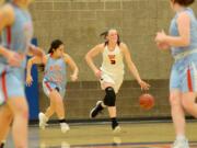 Washougal junior Beyonce Bea dribbles up court against Mark Morris during a 2A district tournament game at Ridgefield High School on Thursday, February 14, 2018. Washougal beat Mark Morris 64-49.