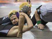 Union's Danny Snediker on his way to pinning Kamiak's Guage Holland during their 4A State Wrestling opening round match in the 152 lb. weight class Friday, Feb. 16, 2018, at the Tacoma Dome in Tacoma, Wash.