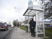 Nathaniel Baker, 19, of Vancouver, waits for the bus Friday on Mill Plain Boulevard near the intersection of Southeast 136th Avenue. C-Tran is working to develop a Mill Plain Boulevard Bus Rapid Transit corridor.