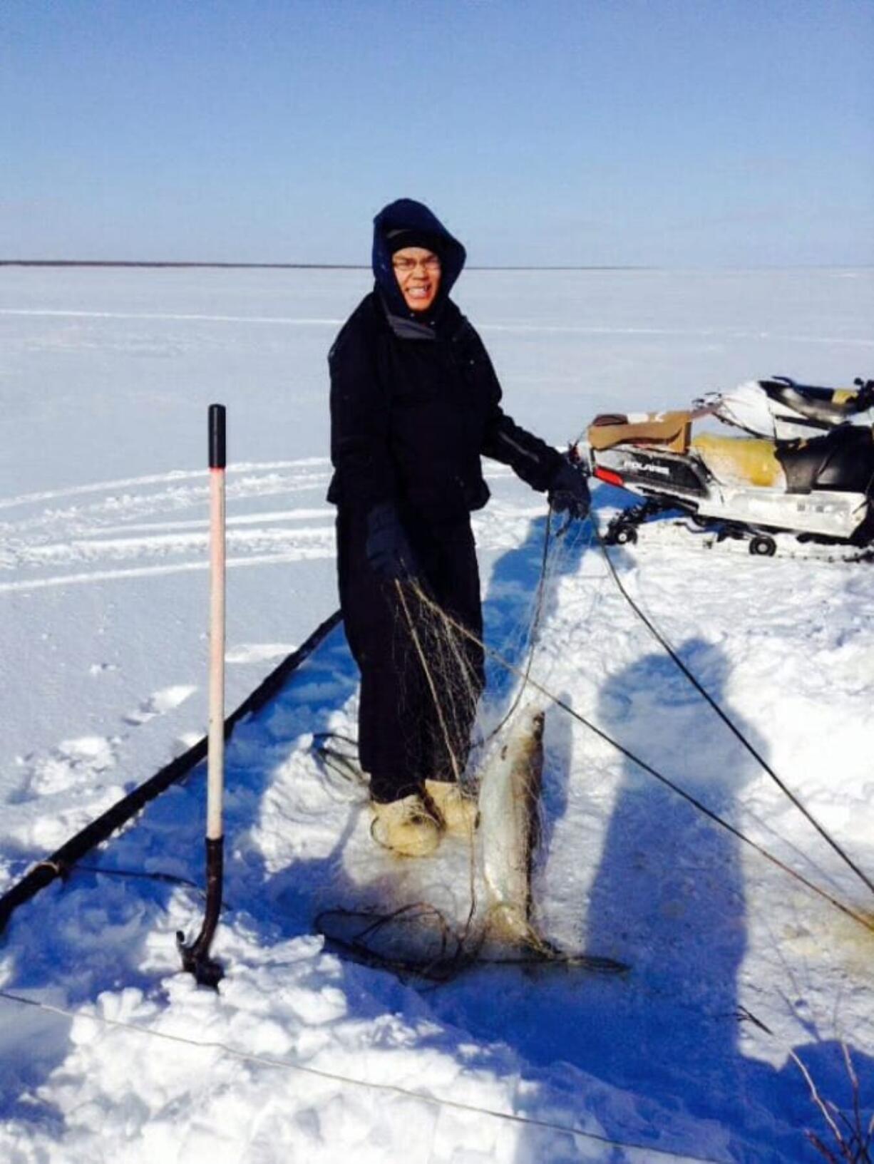 Abraham Hanson doing typical seasonal work in Alakanuk, Alaska, in 2015.