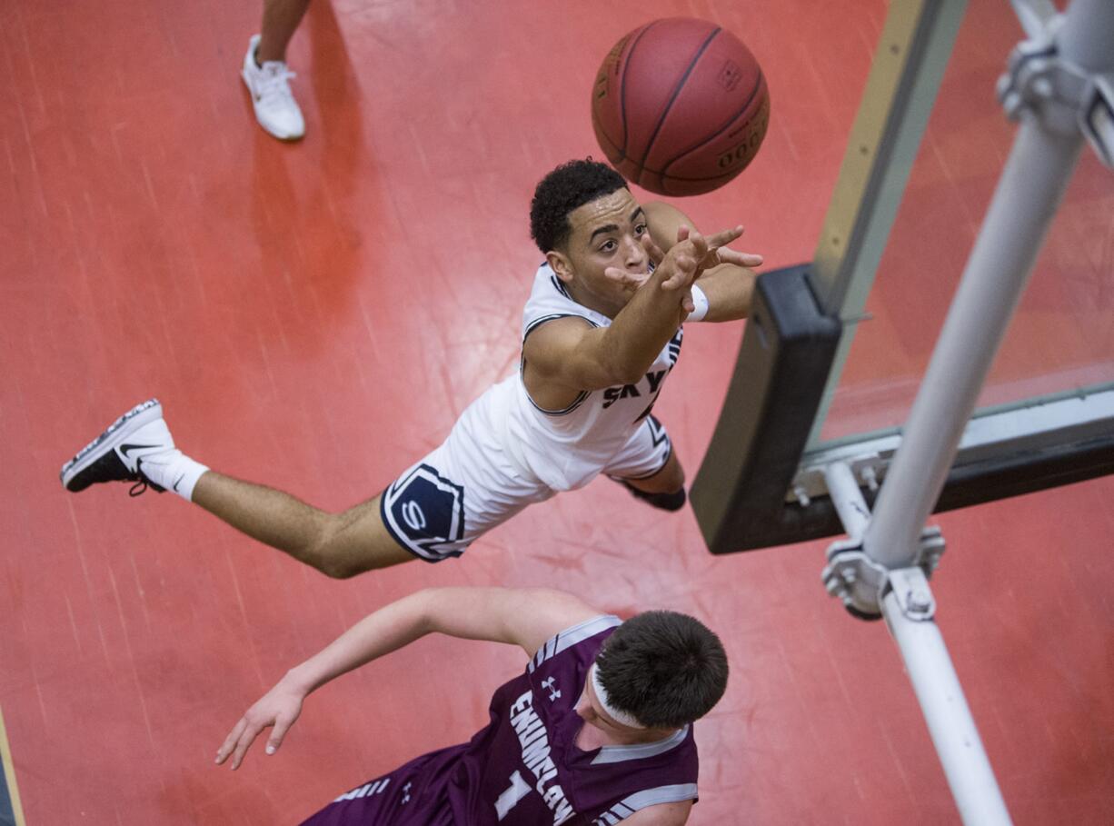 Skyview’s Jovon Sewell (2) launches into the air to make a shot during the 4A regional game against Enumclaw at Battle Ground High School, Saturday February 24, 2018.