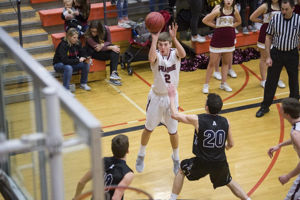 Prairie’s Dante Heitschmidt (2) makes a shot for the Falcons during the 3A regional boys basketball game against Arlington at Battle Ground High School, Saturday February 24, 2018.