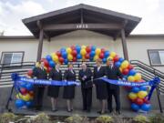 Ministry leaders cut a ribbon at the Salvation Army’s inauguration of a new building in Washougal on Saturday.