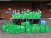 Truman: Members of the Clark Neighbors Food Project with some of the 1,000-plus pounds of food they collected on Feb. 10 to feed hungry local families.