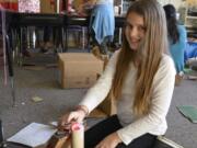 Washougal: Nevaeh McCallister and other Hathaway Elementary School fifth-graders in Andrew Schlauch’s class had to make boxes to collect Valentine’s Day cards using at least two simple machines, such as pulleys, wedges and levers.