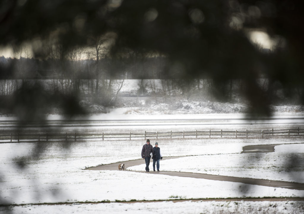 Dennis and Cherie Staehely, both of Vancouver, walk their English Bulldog Barkley along the trail loop next to  Pearson Air Museum and Fort Vancouver National Historic Site on Thursday morning, Feb. 22, 2018.  "It's cold," Cherie said.