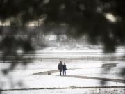 Dennis and Cherie Staehely, both of Vancouver, walk their English Bulldog Barkley along the trail loop next to  Pearson Air Museum and Fort Vancouver National Historic Site on Thursday morning, Feb. 22, 2018.  "It's cold," Cherie said.