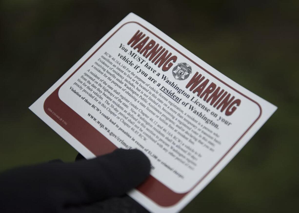 Drivers living in Washington are warned to have up to date license plates, as seen near Harney Elementary School on Monday morning.