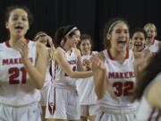 Members of the Camas girls basketball team are all smiles after their win over Union at the Tacoma Dome on Wednesday afternoon, Feb. 28, 2018.