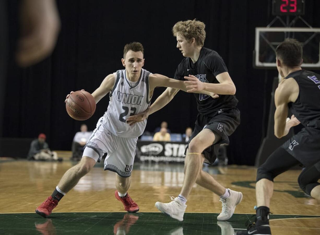 Union’s Ethan Smith (23) drives to the hoop in the third quarter at the Tacoma Dome on Wednesday afternoon, Feb. 28, 2018.