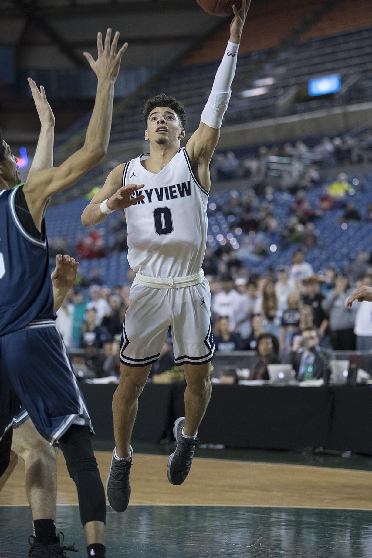 Skyview's Alex Schumacher (0) goes up for a layup in the final seconds of the game against Glacier Peak at the Tacoma Dome on Wednesday night, Feb. 28, 2018.