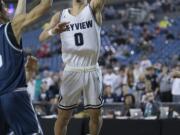 Skyview's Alex Schumacher (0) goes up for a layup in the final seconds of the game against Glacier Peak at the Tacoma Dome on Wednesday night, Feb. 28, 2018.