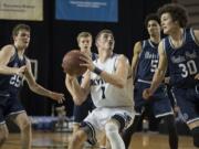 Skyview's Cole Grossman (1) looks to the hoop against Glacier Peak defenders in the third quarter at the Tacoma Dome on Wednesday night, Feb. 28, 2018.