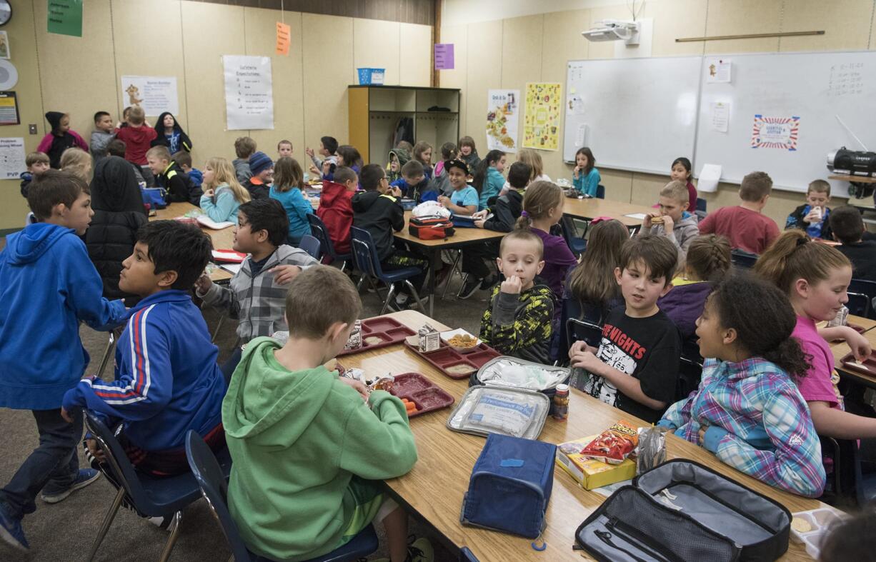 Third-graders eat lunch in a crowded classroom at Pleasant Valley Primary in March. The school is among those the Battle Ground Public Schools had hoped to replace with a bond measure that voters rejected earlier this month.