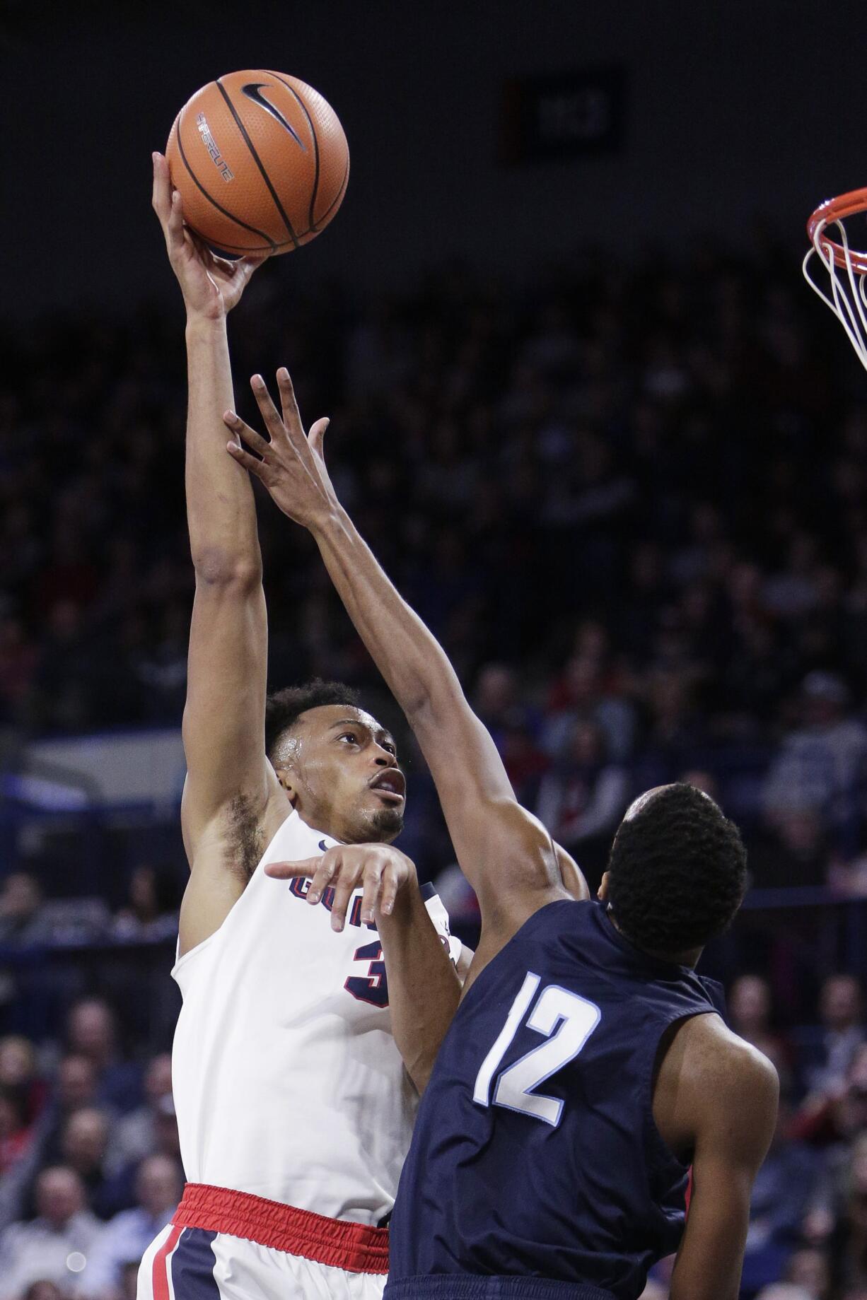 Gonzaga forward Johnathan Williams (3) shoots over San Diego forward Juwan Gray (12) during the first half of an NCAA college basketball game in Spokane, Wash., Thursday, Feb. 1, 2018.