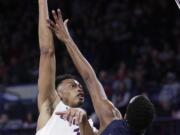 Gonzaga forward Johnathan Williams (3) shoots over San Diego forward Juwan Gray (12) during the first half of an NCAA college basketball game in Spokane, Wash., Thursday, Feb. 1, 2018.