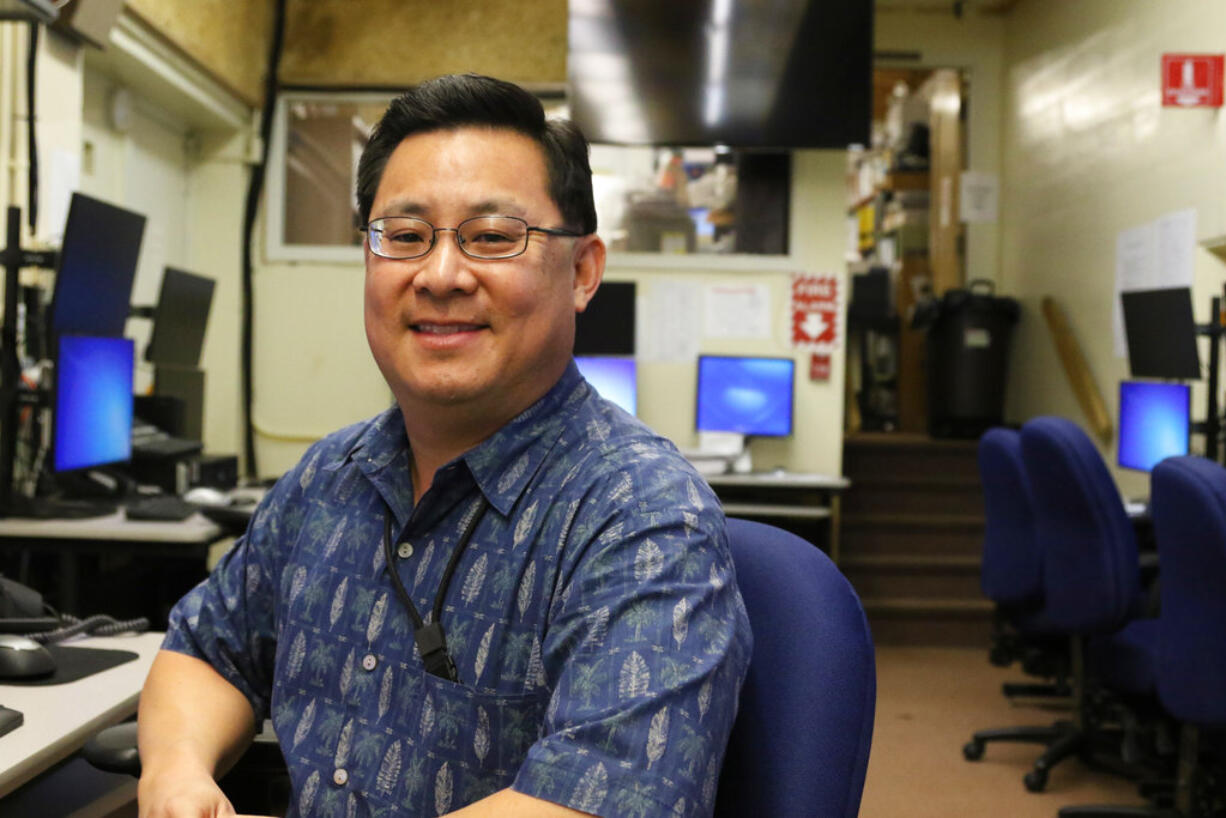 In this Feb. 1, 2018 photo, Jeffrey Wong, current operations officer for the Hawaii Emergency Management Agency, poses for a photo in Honolulu. He filed a police report after seeing threatening comments online from people who confused him with being the agency employee who mistakenly sent a missile alert. He wants to set the record straight that he's not the so-called "button-pusher" and was on a different island when the alert was sent from Honolulu on Jan. 13.