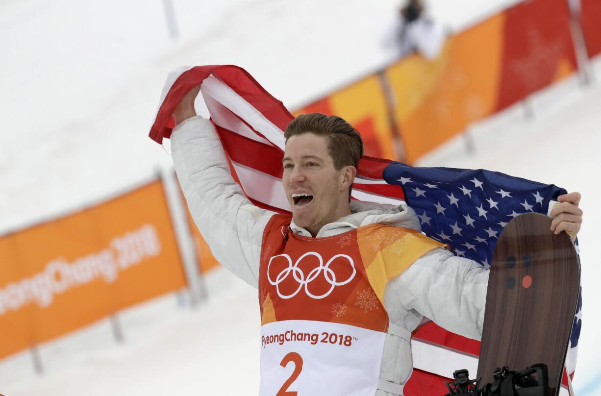 Shaun White, of the United States, reacts to winning gold during the men's halfpipe finals at Phoenix Snow Park at the 2018 Winter Olympics in Pyeongchang, South Korea, Wednesday, Feb. 14, 2018.