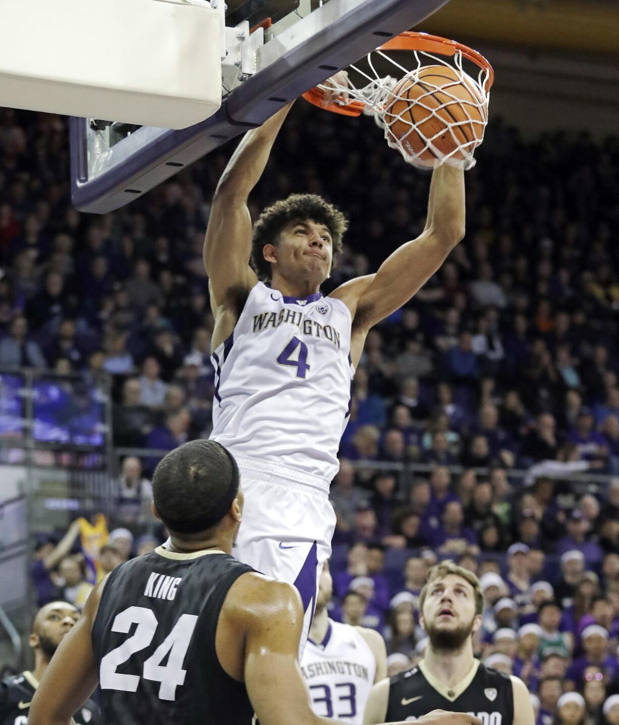 Washington's Matisse Thybulle (4) dunks against Colorado during the second half of an NCAA college basketball game Saturday, Feb. 17, 2018, in Seattle. Washington won 82-59.