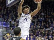 Washington's Matisse Thybulle (4) dunks against Colorado during the second half of an NCAA college basketball game Saturday, Feb. 17, 2018, in Seattle. Washington won 82-59.