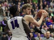 Saint Mary's center Jock Landale, right, looks to pass as Portland forward Tahirou Diabate defends during the first half of an NCAA college basketball game in Portland, Ore., Saturday, Feb. 17, 2018.