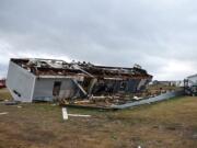 A mobile home is seen destroyed after a tornado struck an area outside Joshua, about 20 miles (32 kilometers) south of Fort Worth, Texas, Tuesday, Feb. 20, 2018. Two weak tornadoes have hit North Texas, demolishing at least one mobile home and damaging about a dozen others in the rural area near Joshua and damaging the roofs of homes in the Dallas suburb of DeSoto.