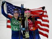 United States' Jessica Diggins, left, and Kikkan Randall celebrate after winning the gold medal in the women's team sprint freestyle cross-country skiing final at the 2018 Winter Olympics in Pyeongchang, South Korea, Wednesday, Feb. 21, 2018.