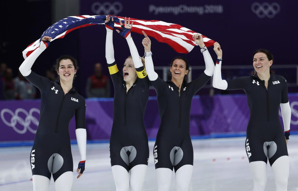 Bronze medalist team U.S.A. with Heather Bergsma, right, Brittany Bowe, second right, Mia Manganello, second left, and Carlijn Schoutens, left, celebrates after the women's team pursuit final speedskating race at the Gangneung Oval at the 2018 Winter Olympics in Gangneung, South Korea, Wednesday, Feb. 21, 2018.