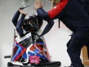 Driver Elana Meyers Taylor and Lauren Gibbs of the United States celebrate after their silver medal winning heat during the women's two-man bobsled final at the 2018 Winter Olympics in Pyeongchang, South Korea, Wednesday, Feb. 21, 2018.