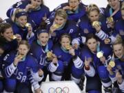 Untied States hockey team celebrate with their gold medals after beating Canada in the women's gold medal hockey game at the 2018 Winter Olympics in Gangneung, South Korea, Thursday, Feb. 22, 2018.