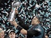 Philadelphia Eagles’ Nick Foles holds up the Vince Lombardi Trophy after the NFL Super Bowl 52 football game against the New England Patriots, Sunday, Feb. 4, 2018, in Minneapolis. The Eagles won 41-33.