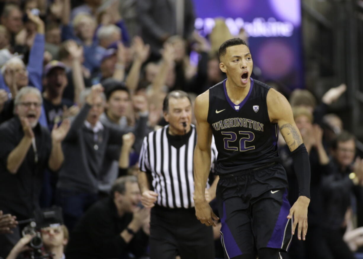 Washington’s Dominic Green reacts after sinking a 3-point basket during the second half against Arizona in an NCAA college basketball game Saturday, Feb. 3, 2018, in Seattle. Washington won 78-75 with Green later hitting the tie-breaking shot in the final seconds.