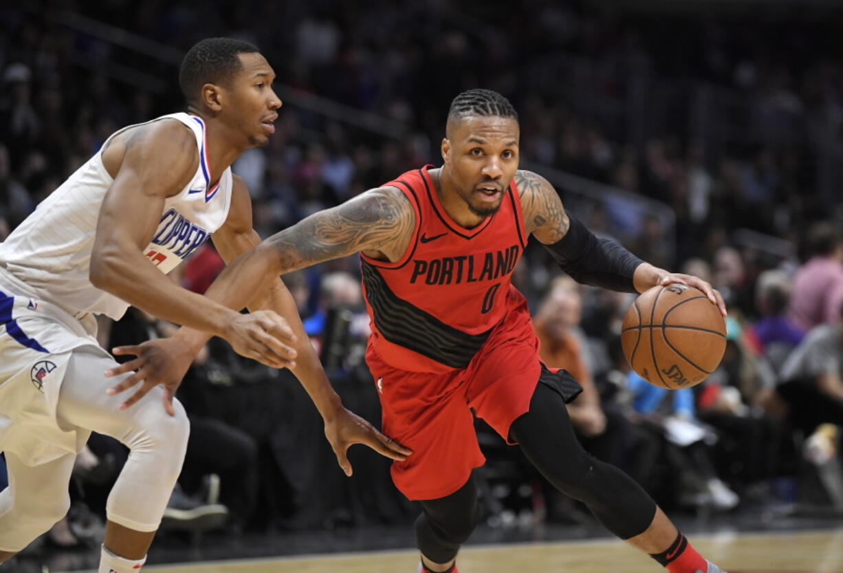 Damian Lillard, right, and the Trail Blazers have been known for their post-All-Star break revivals for the past two seasons. Those late-season rallies will no doubt be an ongoing theme in the congested Western Conference playoff race once Portland resumes the season on Friday. Mark J.