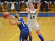 La Center guard Taylor Stephens defends an Elma player in the second quarter of the Wildcats' 54-50 win over Elma in the 1A district championship game on Wednesday, Feb. 14, 2018 at Rochester High School.