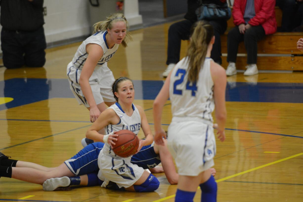 A La Center guard gains possession of a loose ball in the second quarter of the Wildcats' 54-50 win over Elma in the 1A district championship game on Wednesday, Feb. 14, 2018 at Rochester High School.