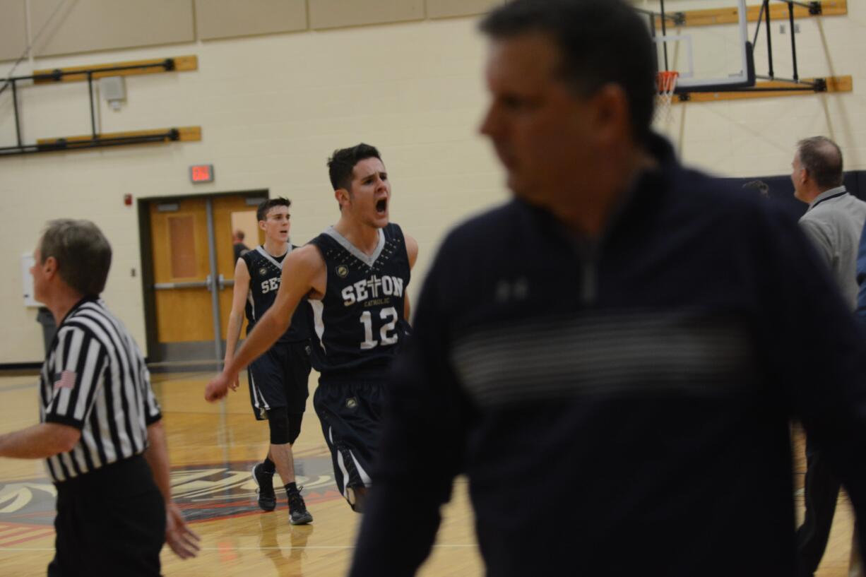 Seton Catholic's Hayden Miller celebrates going into halftime with a 35-18 lead. Seton beat Stevenson 56-41 in a loser-out 1A district playoff game on Thursday, Feb. 15 2018 at King's Way Christian.