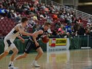 King's Way guard Brady Metz (31) drives to the hoop in the first half of a 60-57 1A state tournament win over Cascade Christian on Wednesday, Feb.