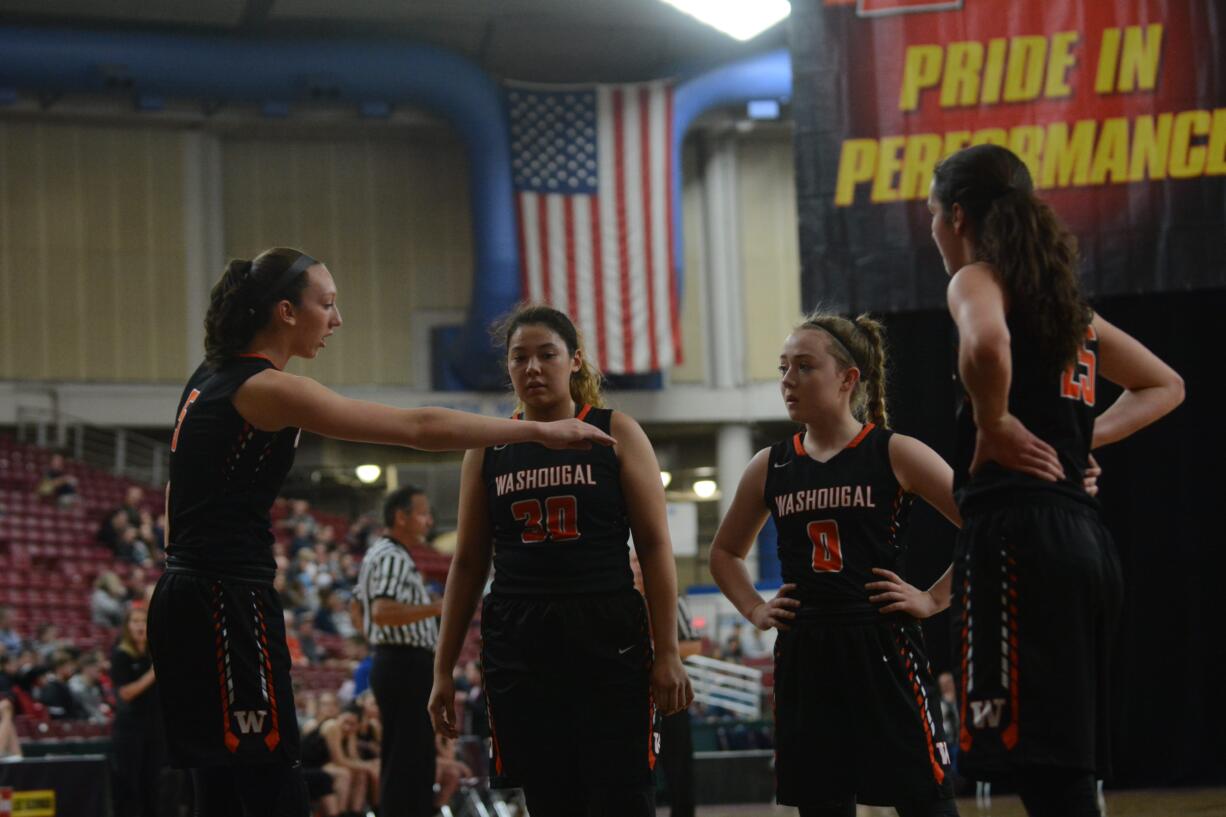 Washougal's Beyonce Bea (5) game-plans with Tiana Barnett (3), Kiara Cross (0) and Skylar Bea (25) during a break in play in the Panthers' 55-46 loss to Lynden on Wednesday, Feb.