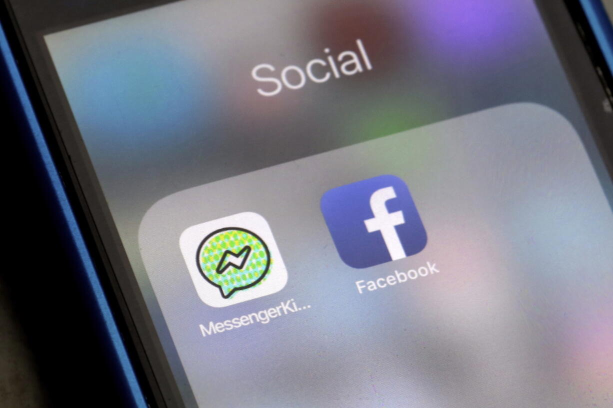 Facebook and Facebook’s Messenger Kids app icons are displayed Friday on an iPhone in New York. Messenger Kids lets kids under 13 chat with friends and family. It displays no ads and lets parents approve who their children message.