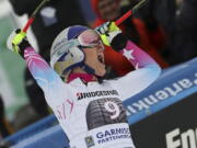 United States’ Lindsey Vonn celebrates her victory in the finish area after a women’s World Cup downhill race in Garmisch-Partenkirchen, Germany, Saturday, Feb. 3, 2018.