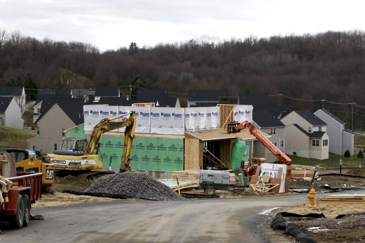 New home construction is underway March 1 in a housing plan in Zelienople, Pa. Home construction got off to a strong start in the new year, the Commerce Department reported Friday.