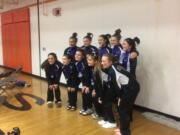 The Columbia River gymnastics team pose after winning the 3A district meet at Battle Ground High School on Saturday, Feb. 3, 2018.