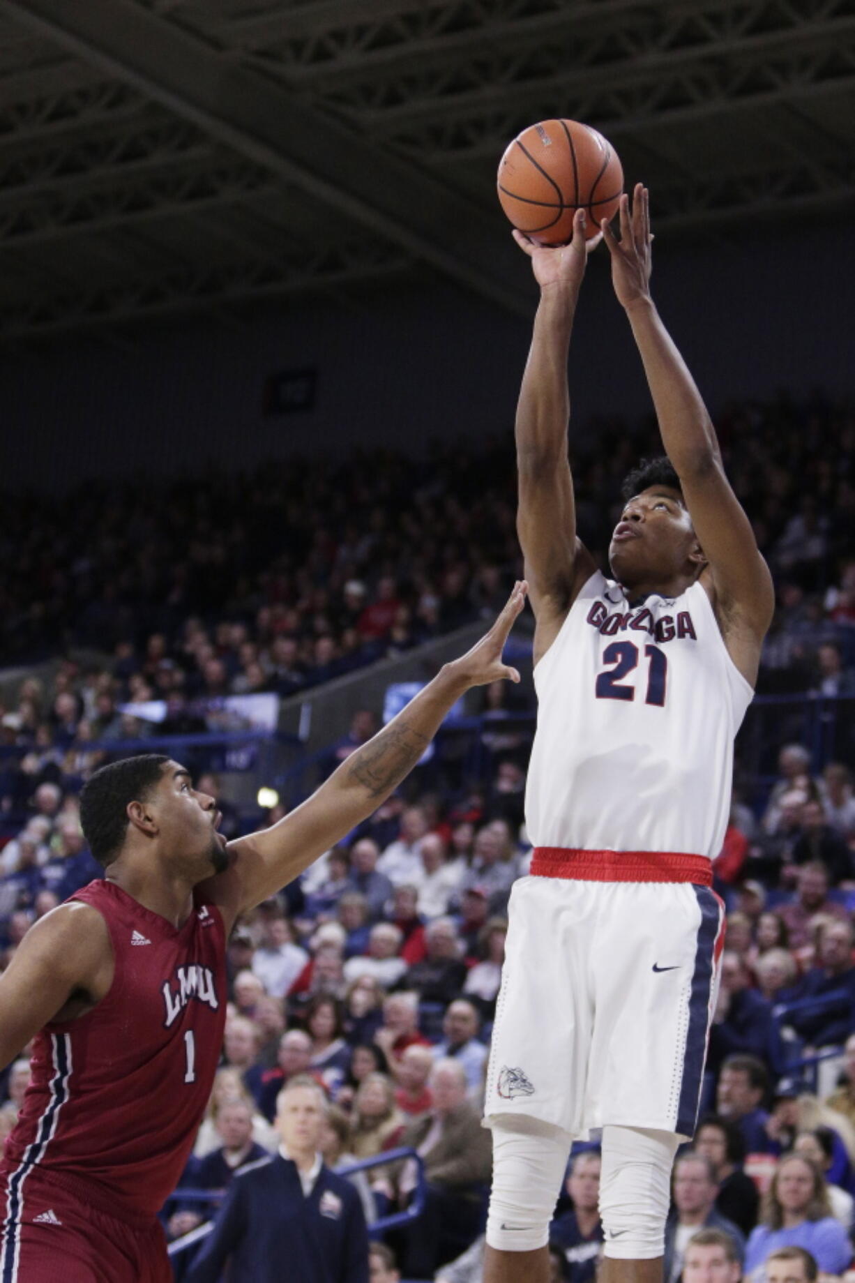 Gonzaga forward Rui Hachimura (21) shoots over Loyola Marymount forward Zafir Williams (1) during the first half of an NCAA college basketball game in Spokane, Wash., Thursday, Feb. 15, 2018.