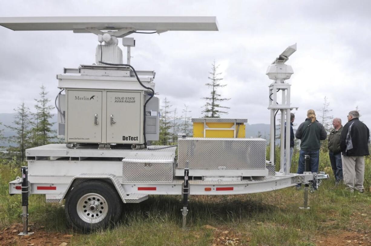 FILE - In this Wednesday, June 16, 2010 photo, a “Merlin” sits atop Radar Ridge recording any nearby Marbled Murrelet activity near Naselle, Wash. Environmental officials in Oregon will decide Friday, Feb. 9, 2018, whether to increase protections for a rare kind of seabird that nests far inland in old-growth forests. The Oregon Commission on Fish and Wildlife is expected to vote on whether to change the listing of the marbled murrelet from “threatened” to “endangered” after receiving a petition from a coalition of environmental groups concerned about declining numbers of the small bird.