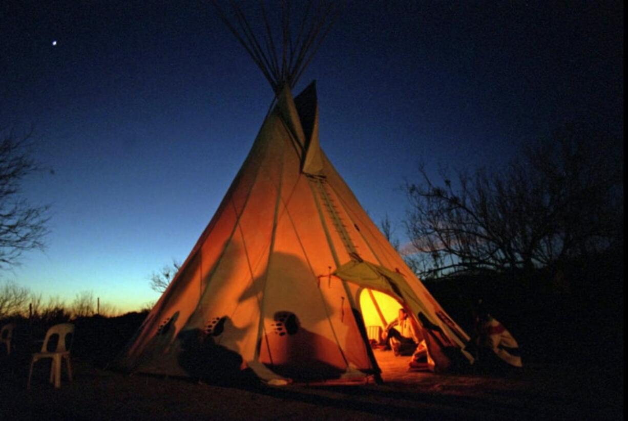 Members of the Native American Church prepare Feb. 17, 1996, for a prayer meeting in Mirando City, Texas. The Native American Church of North America has settled a lawsuit in late Jan. 2018, against the Transportation Security Administration, leading to more training for agents on how to screen religious items.